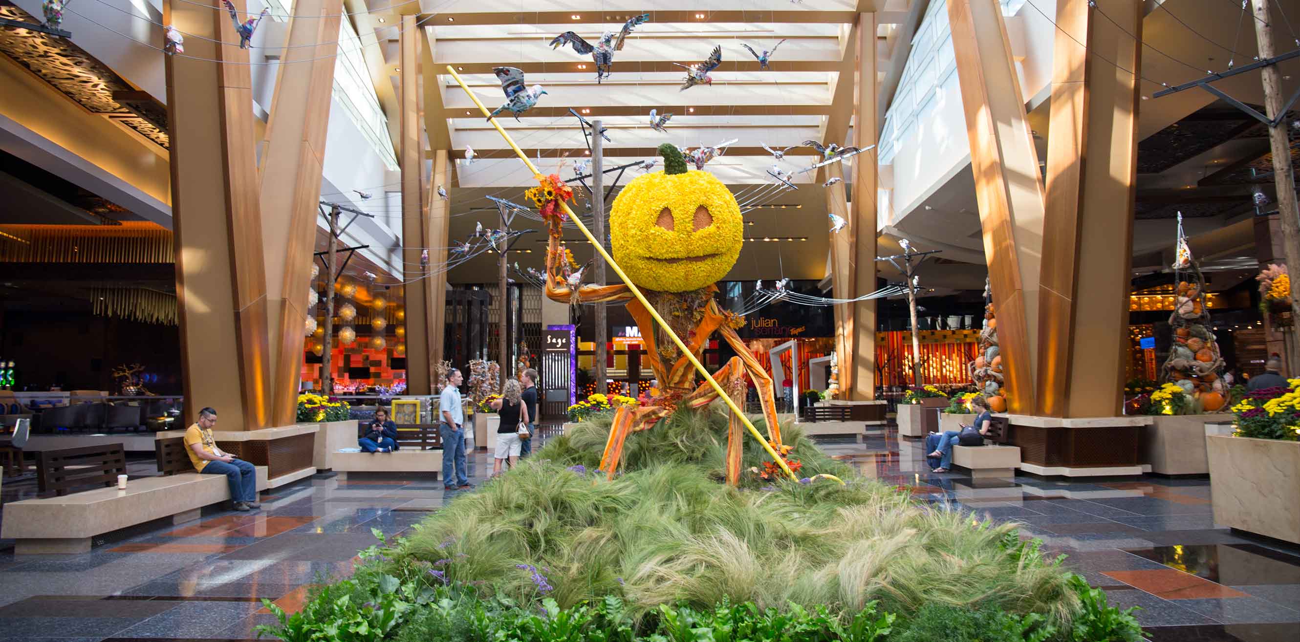 A pumpkin-headed figure for a Halloween themed installation